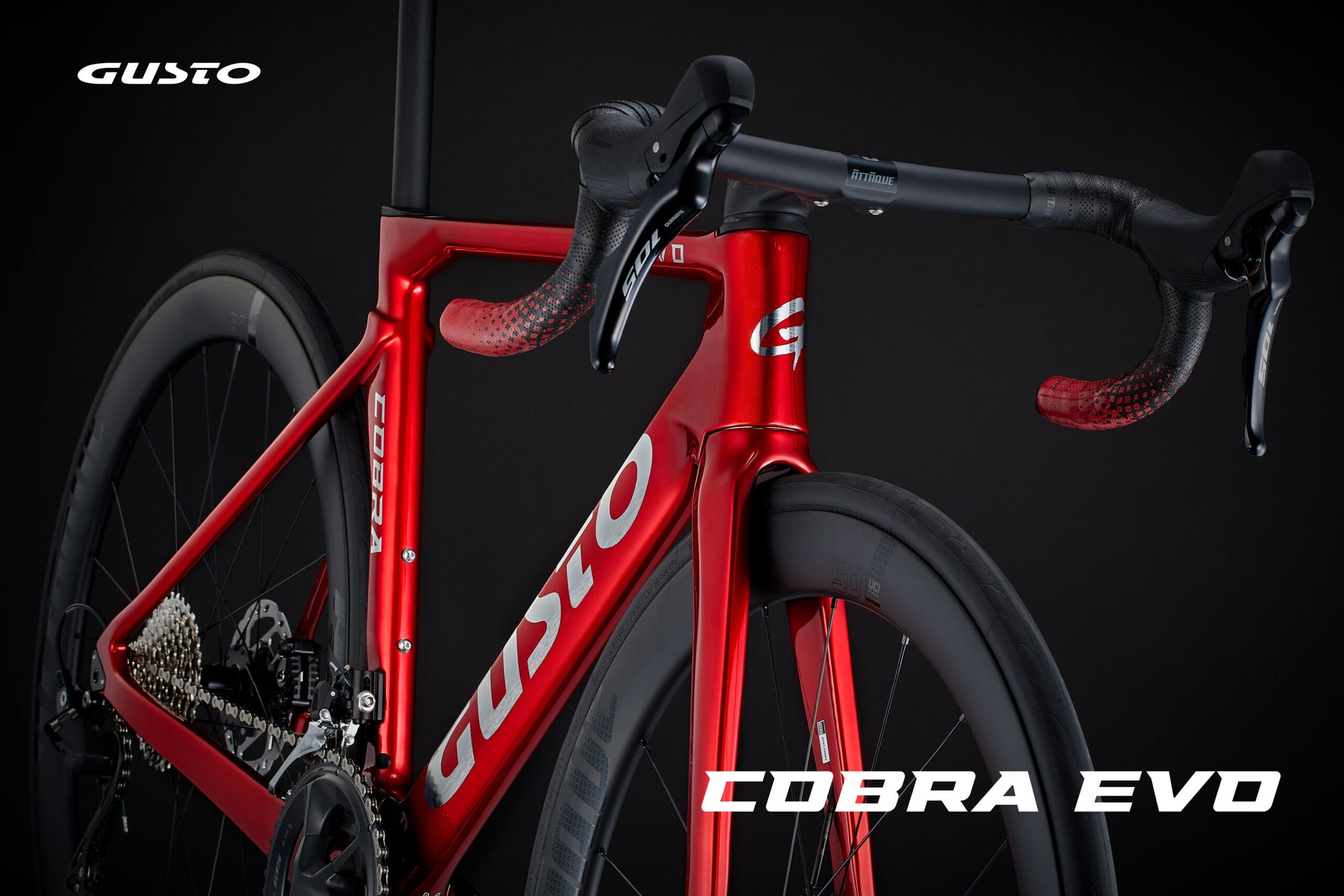 Red bicycle with 'Gusto' branding on a black background