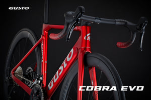 Red bicycle with 'Gusto' branding on a black background