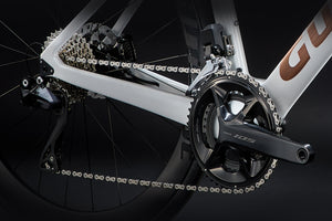 Close-up of a bicycle's chain and gear system on a black background