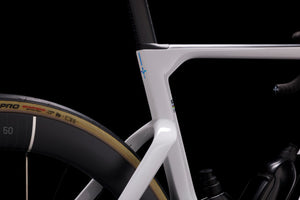 Close-up of a bicycle frame with a black background