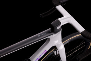 Close-up of a white bicycle frame with 'Fulcrum' branding on a black background